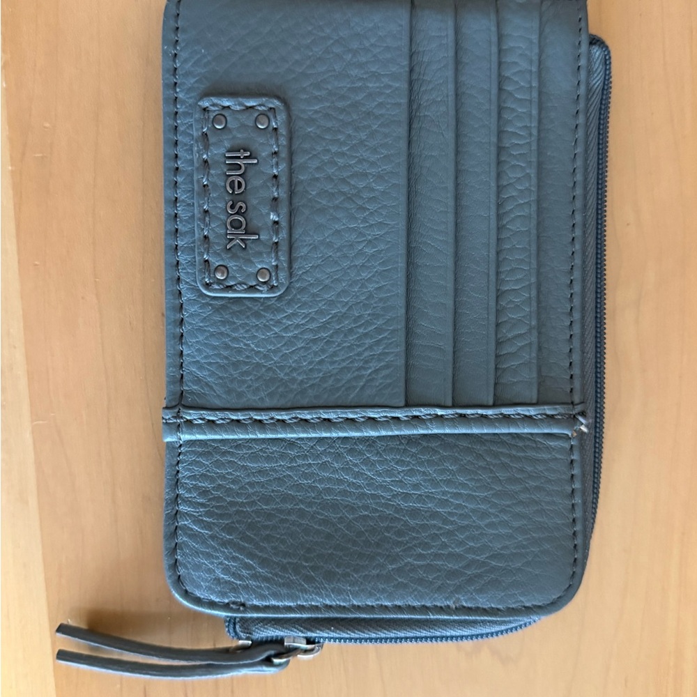 The Sak pebble leather card wallet in teal.